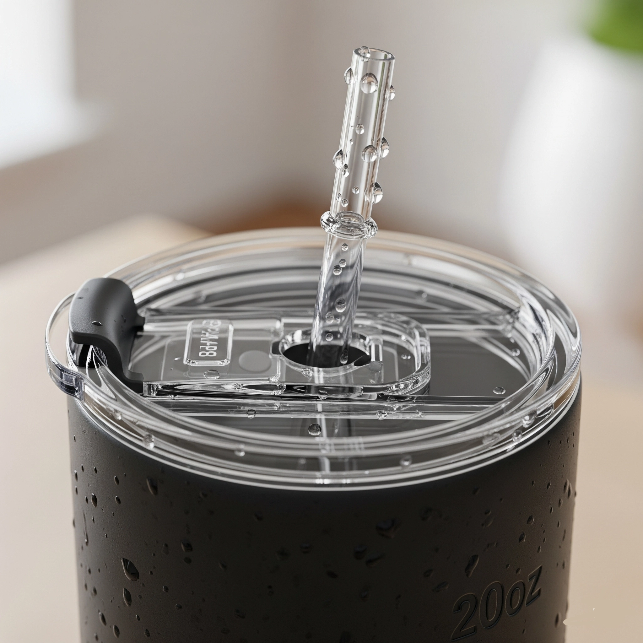 Close-up view of the spill-resistant lid and straw on a custom skinny tumbler.
